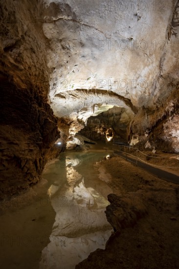 Stalactites and stalagmites, reflection in a small underground lake, rock formations in a stalactite cave, Grotta del Fico, Gulf of Orosei, Baunei, Sardinia, Italy