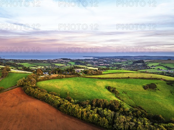 Sunset of Devon Farms and Fields over Berry Pomeroy from a drone, Totnes, England, United Kingdom