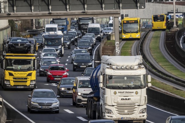 Heavy traffic on the A40 motorway, Ruhrschnellweg, height of the Essen-Ost motorway junction, looking east, 6-lane motorway, with 2 bus lanes in the middle, rush hour traffic, North Rhine-Westphalia, Germany