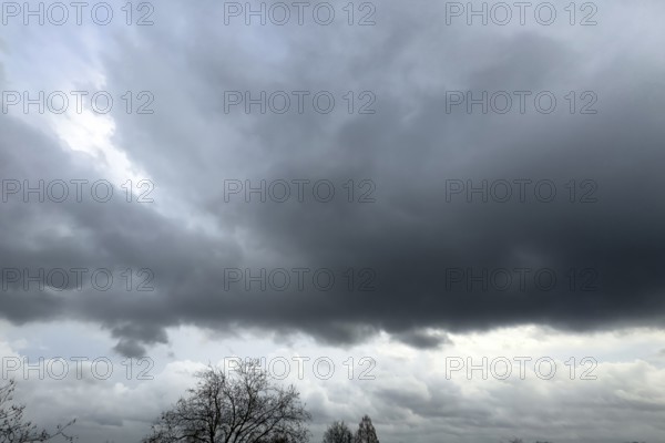 Large grey cloud roller Stratocumulus cluster layer cloud during high winter conditions, international