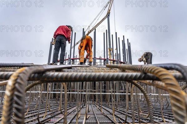 Assembly of reinforcing steel for the reinforced concrete foundation of a wind turbine, a mesh of rebar and rebar mesh, over 100 tons of reinforcing steel were used, the wind turbine will have a hub height of 160 meters, part of a new wind farm in Sauerland, near Balve, North Rhine-Westphalia, Germany
