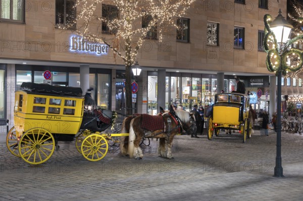 Historic stagecoach rides with horseback during the Nuremberg Christmas Market, Nuremberg, Middle Franconia, Bavaria, Germany
