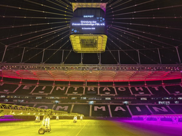 The Frankfurt Waldstadion (Deutsche Bank Park) is illuminated in red to mark the founding of the Women's Bundesliga Association and the video cube reads: Founding of the Women's Bundesliga FBL e.V. - 10 December 2025, Waldstadion, Frankfurt am Main, Hesse, Germany