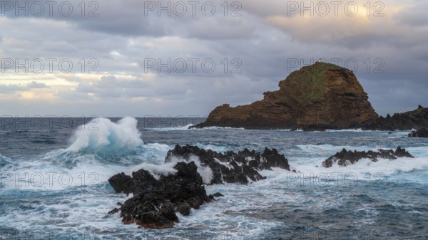 Sunset, waves and rocks, coast near Porto Moniz, Madeira, Portugal