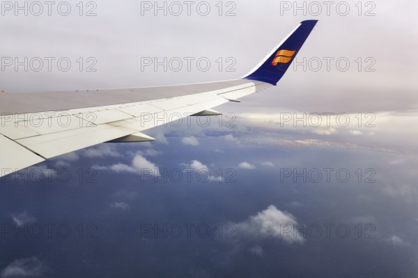 Wing, airplane, Icelandair airline logo, flying to Boston, view of Reykjavik, aerial view, Iceland