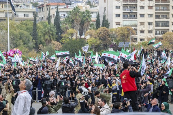 Damascus, Syria – December 08, 2025: A military parade by Syrian army units marking the first anniversary of liberation and the change of Assad's regime, held in Umayyad Square in central Damascus, attended by thousands of people, Damascus, Damascus, Syria