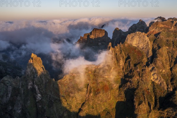 Aerial view, sunrise at Pico do Arieiro, clouds of fog sweeping over mountain peaks, Madeira, Portugal