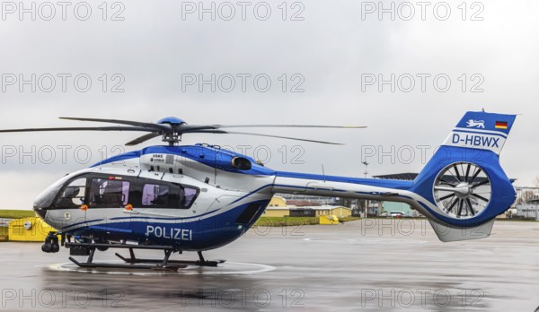 Helicopter from the Baden-Württemberg Police team in front of the hangar at the airport. Airbus Helicopters H145. Stuttgart, Baden-Württemberg, Germany