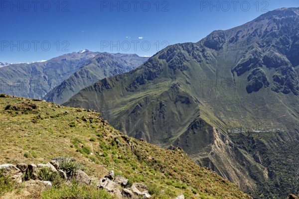Clear view of a vast mountain landscape under a blue sky, The mountains and valleys of the Colca Canyon in Peru