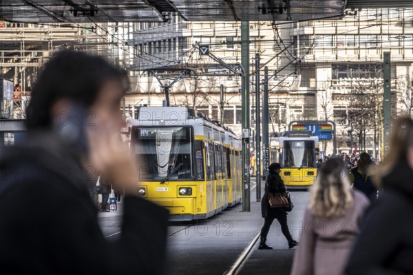 Trams at Alexanderplatz in Berlin, passers-by, Germany