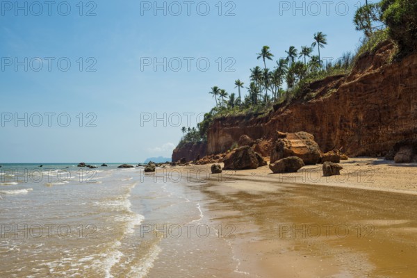 Lonely beach with red rocks and coconut trees, Red Cliffs, Bang Saphan Noi, Prachuap Khiri Khan Province, Central Thailand, Thailand