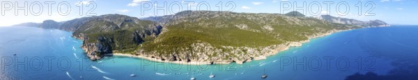 Panorama, picturesque rocky coast, cliffs and Cala Luna beach, aerial view, Golfo di Orosei, Baunei, Sardinia, Italy