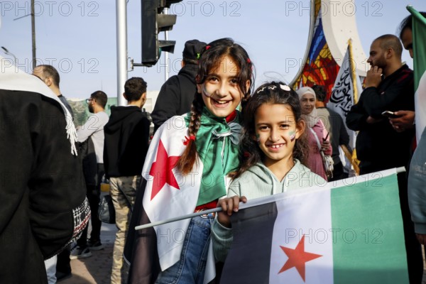 Damascus, Syria. November 28, 2025: Thousands of Syrians gather in Umayyad Square in central Damascus to celebrate the anniversary of the military operation that led to the fall of Bashar al-Assad's regime. Demonstrators express joy and unity while denouncing Israeli attacks on Syrian territory, Damascus, Damascus, Syria