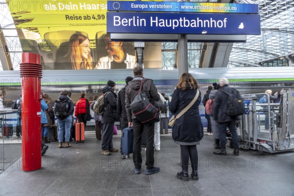 Central Station in Berlin, passengers on the platform, train arrives, Germany