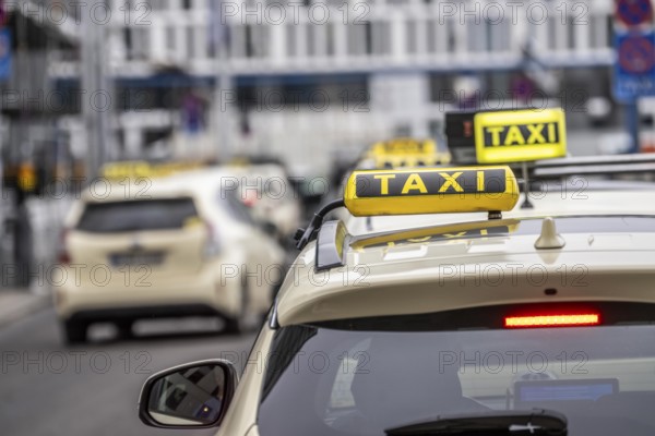 Taxis in front of the main train station in Berlin, waiting in line for passengers, Germany