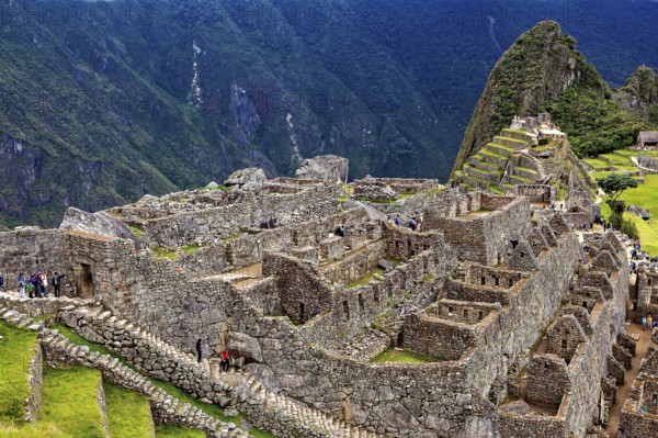 Comprehensive Ruin Landscape with Views of Mountains and Clouds, The Ruins of the Inca City of Machu Picchu in Peru