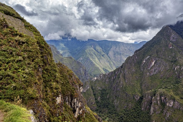 Hilly mountain landscape under cloudy sky, The Urubamba Valley near Machu Picchu in Peru