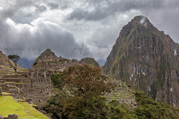 Mystical atmosphere above the ruins of Machu Picchu surrounded by clouds and mountains, The ruins of the Inca city of Machu Picchu in Peru
