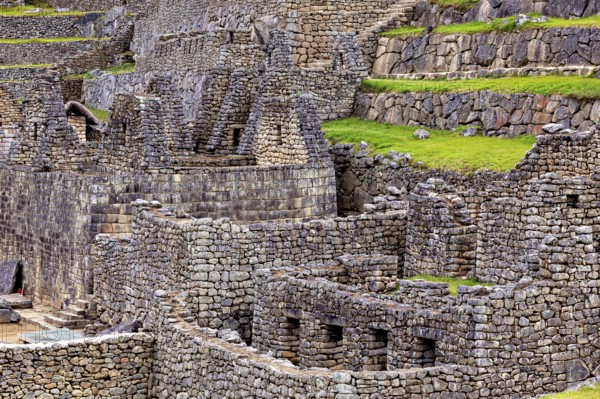 Detailed Inca stone structures and green terraces near Machu Picchu, The ruins of the Inca city of Machu Picchu in Peru