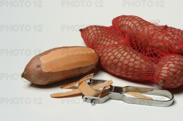 Sweet potato with potato peeler, Ipomoea batatas