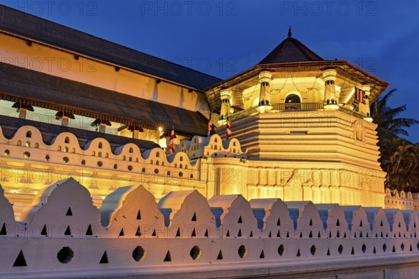 Night view of a historically illuminated building with geometric patterns, The Temple of the Tooth in Kandy Sri Lanka