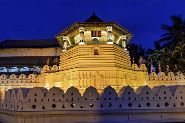 Impressive night lighting of a historic building with traditional elements, The Temple of the Tooth in Kandy Sri Lanka