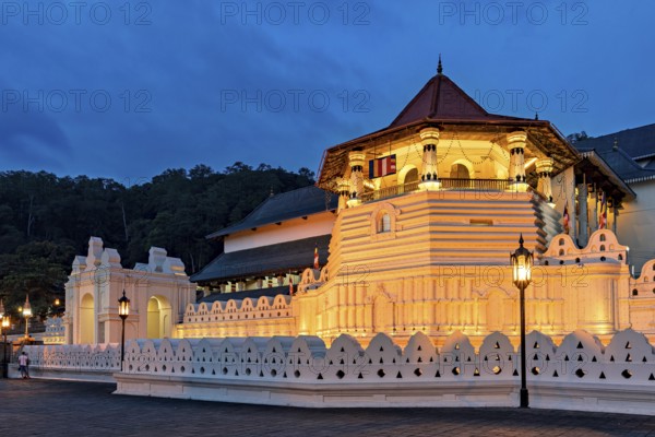 Historic building illuminated at night with atmospheric lighting, The Temple of the Tooth in Kandy Sri Lanka