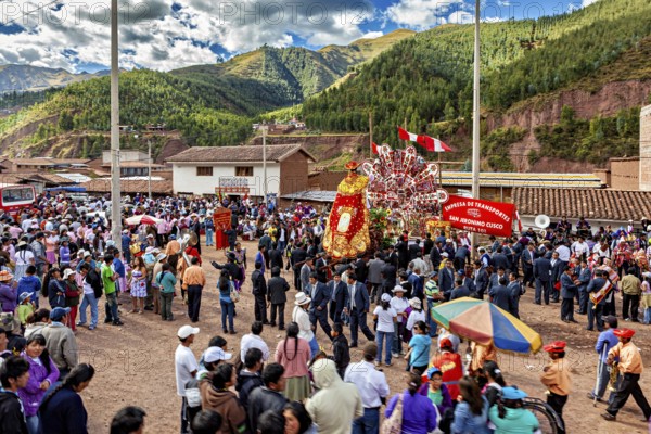 Large gathering of people at an open-air festival, traditional parade of festival groups in Cusco in Peru