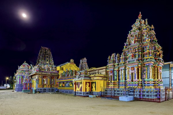 Colourful temples at night in moonlight with artfully designed reliefs, The Sri Pathrakali Amman Trincomalee in Sri Lanka