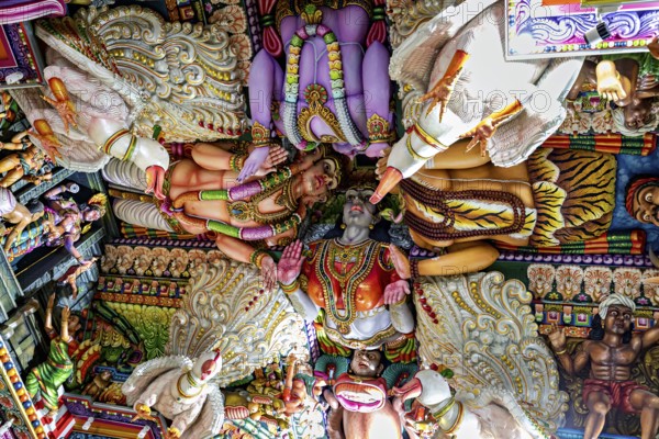 Detailed ceiling painting in a temple with bright colors and Hindu figures, The Sri Pathrakali Amman Trincomalee in Sri Lanka