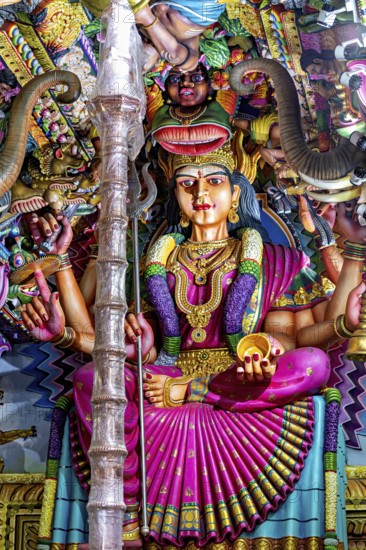 Magnificent sculpture of a goddess in a temple surrounded by detailed decorations, The Sri Pathrakali Amman Trincomalee in Sri Lanka