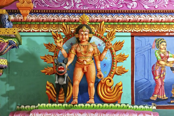 Temple sculpture with mythological scenes in bright colors and detailed depiction, The Sri Pathrakali Amman Trincomalee in Sri Lanka