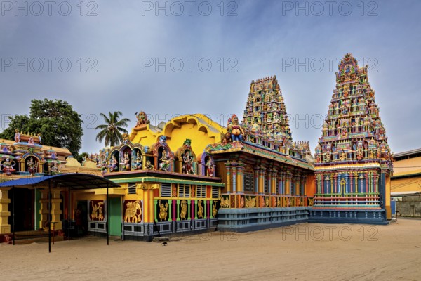 Hindu temple with colorful sculptures and traditional architecture under clear skies, The Sri Pathrakali Amman Trincomalee in Sri Lanka