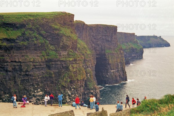 People on the cliff edge, there was no fence back then, Cliffs of Moher, County Clare, Republic of Ireland, July 21, 1993, vintage, retro, old, historic