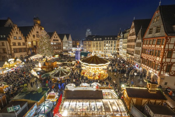 With the lighting on the Mrs. Holle Christmas tree, a 30-meter high Nordmann fir tree, the Frankfurt Christmas Market was officially opened on 24.11.2025. The Christmas market will be open until December 22 from Monday to Saturday from 10:00 to 21:00 and on Sundays from 11:00 to 21:00, Römerberg, Frankfurt am Main, Hesse, Germany
