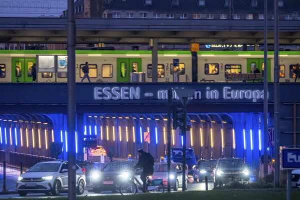 The main train station in Essen, blue-lit underpass, bus station, am Europaplatz, public transport train on the platform, North Rhine-Westphalia, Germany