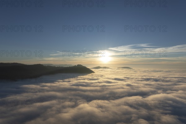 Sunset over the sea of fog from Beurener Fels to Hohenneuffen Castle, Swabian Alb, Baden-Württemberg, Germany