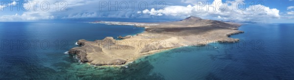 Headland and blue sea, coastal landscape, arid landscape of Los Ajaches Natural Park, aerial view, Lanzarote, Canary Islands, Spain