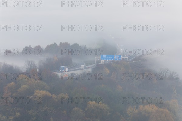 Aichelberg Alb climb of the A8 in thick fog on an autumn morning. Lkr. Göppingen, Baden-Württemberg, Germany