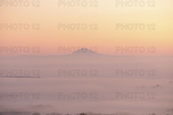 Hohenstaufen in the golden morning light, Aichelberg. Spectacular dawn over the foggy foothills of Alb