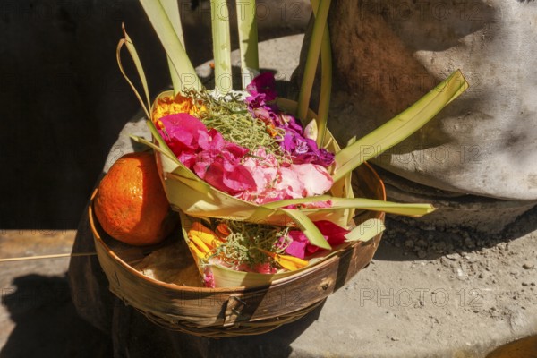 Canang Sari is a Balinese offering that expresses Wasa (God) or the creators of life to Sang Hyang Widhi. The offerings are used to balance and maintain peace on earth, between good and evil, between gods and demons, between heaven and hell, Kuta beach, Bali, Indonesia