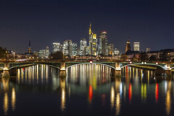The lights of Frankfurt's banking skyline glow in the evening, Frankfurt am Main, Hesse, Germany