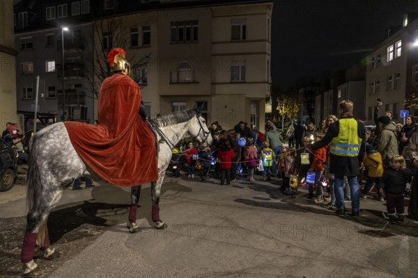 Martinszug in Essen-Rüttenscheid, the parish of St. Lambertus, Saint Martin actor on a horse, with over 500 participants, North Rhine-Westphalia, Germany