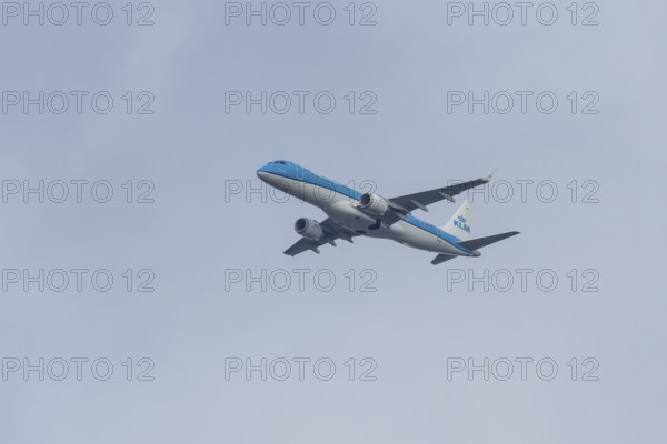Embraer ERJ-190 jet passenger aircraft of Royal Dutch KLM cityhopper airlines in flight on approach to London city airport, England, United Kingdom