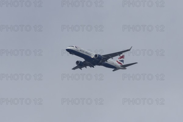 Embraer ERJ-190 jet passenger aircraft of British Airways BA CityFlyer airlines in flight on approach to London city airport, England, United Kingdom