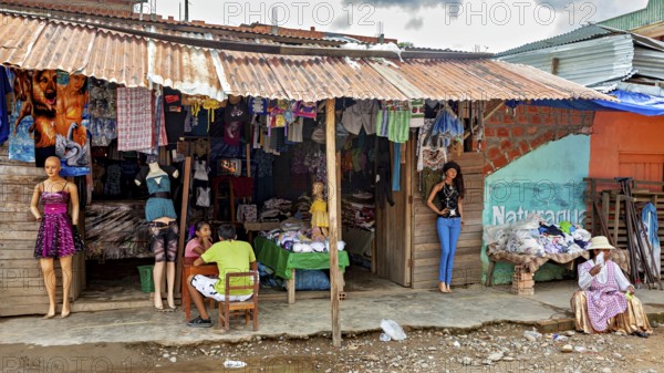 A small shop at a market with clothes and mannequins in a rural setting, The Rurrenabaque market in the Amazon jungle rainforest in Bolivia