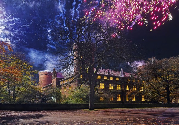 Big fireworks from the towers of Kurcölnischer Castle to Martin's procession in the evening, Old Town, Kempen, Lower Rhine, North Rhine-Westphalia, Germany