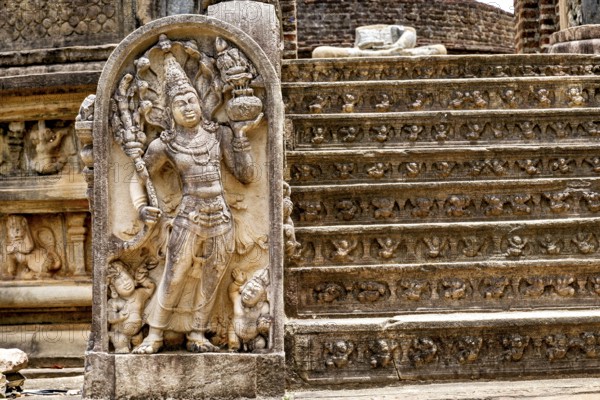 Ancient stone sculpture on decorated staircase, part of a historic ruin site, The temples of Polonnaruwa in Sri Lanka