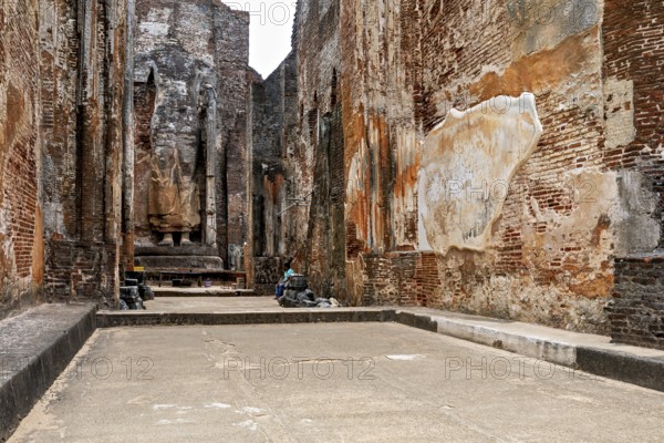 Interior view of an archaeological site with large statues and brick walls, The temples of Polonnaruwa in Sri Lanka