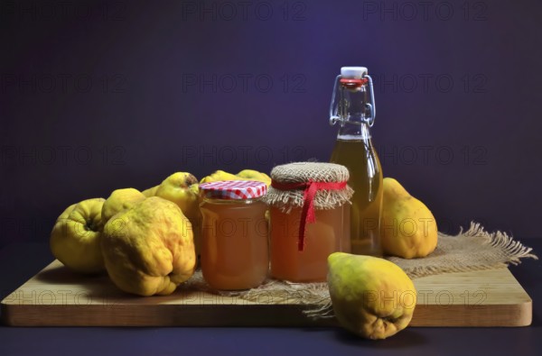 Still life with quinces, homemade quince jelly and quince liqueur, autumn, Germany